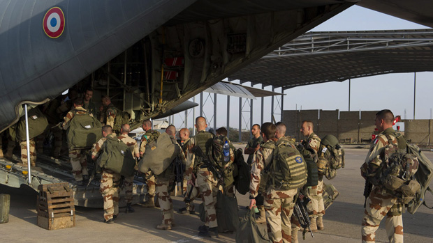 French soldiers of the 21st Marine Infantry Regiment board a plane to Bamako, the capital from Mali, at the N'Djamena's airport, in Chad.