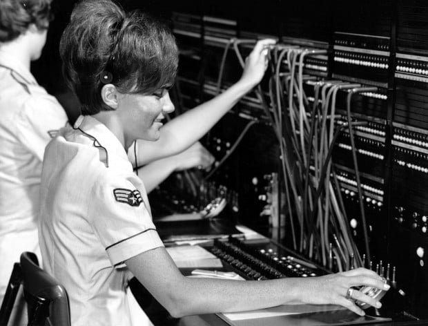 A telephone switchboard operator. Image courtesy of Wikimedia Commons.