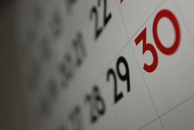 a calendar showing social ad campaigns and end of month results