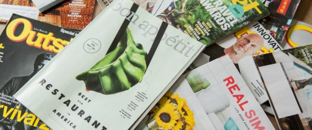Pile of magazine advertisements