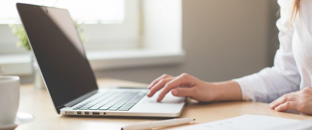 Salesperson working on their laptop