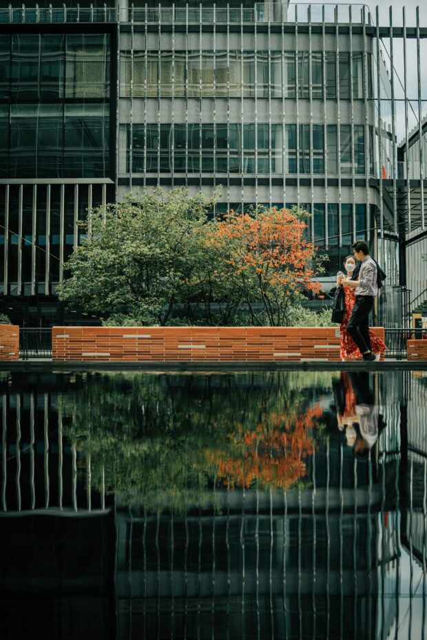 two people walking along the banks of a river