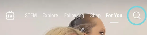 Magnify glass icon in TikTok that opens a search bar