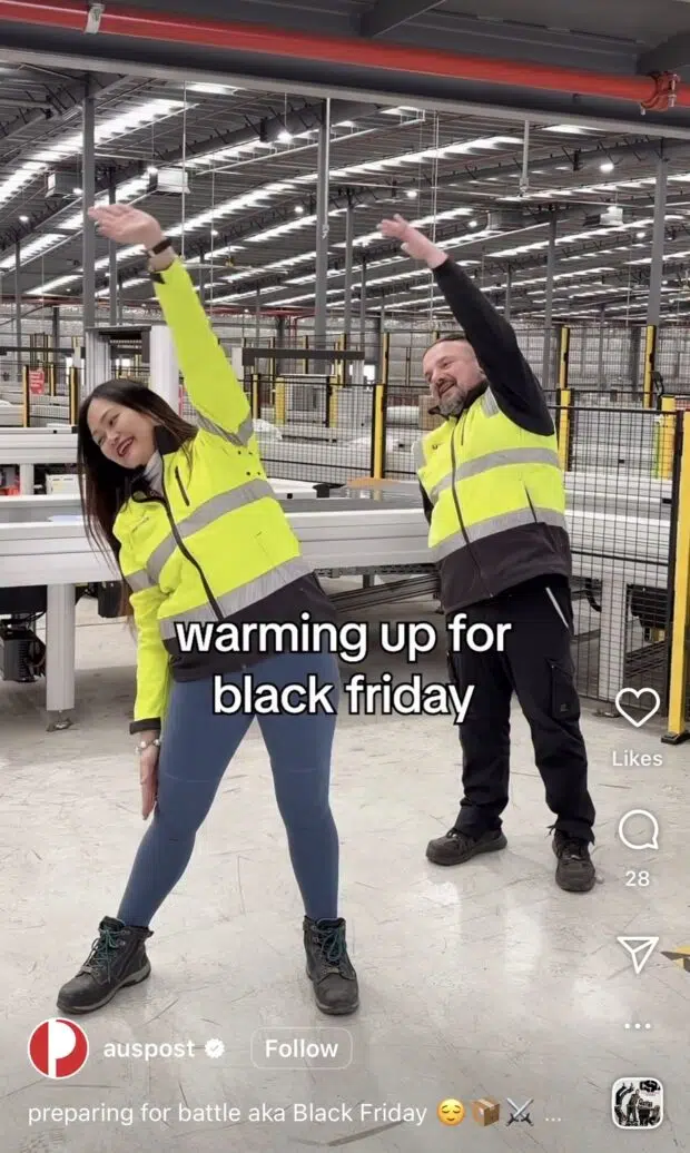 A behind-the-scenes video still showing Australia Post employees stretching before the busy Black Friday shipping rush.