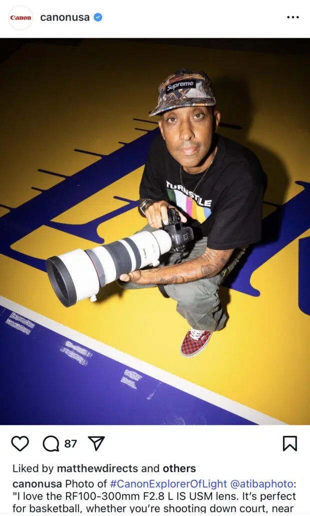 A photographer from Canon’s Explorers of Light program holding professional camera gear.