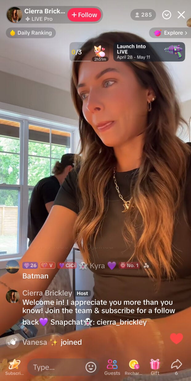 Cierra Brickley livestreams in a kitchen, greeting viewers with “Welcome in!” and encouraging subscriptions. Viewer interactions and TikTok LIVE graphics appear on screen.
