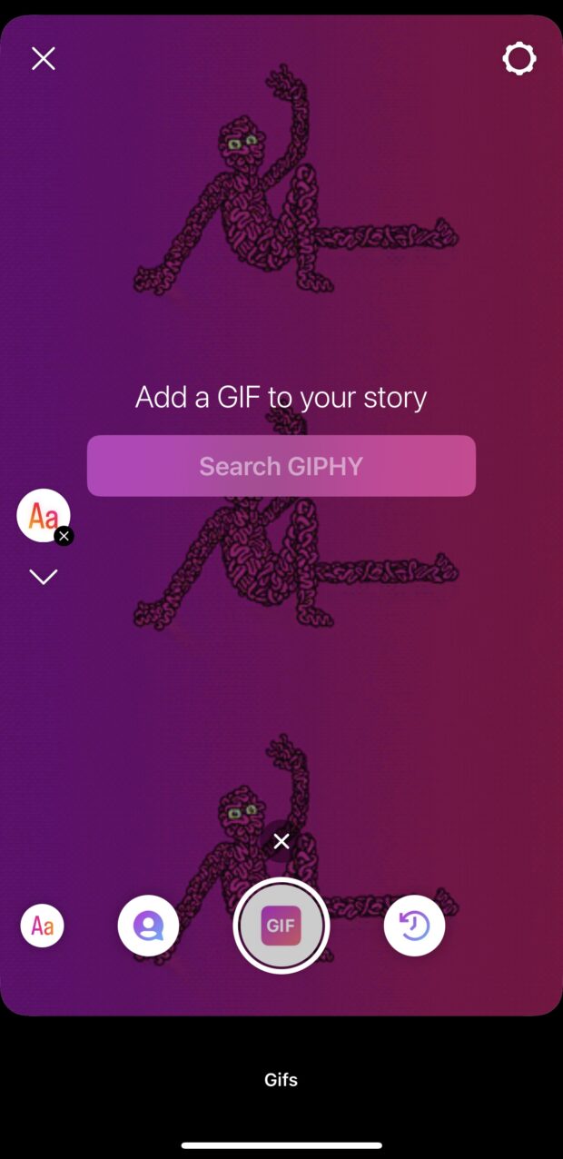 instagram story camera showing GIPHY search function and static GIF in the background of a pink monster smiling and waving