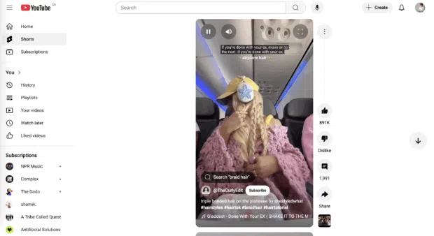 youtube shorts home page showing blonde girl on airplane braiding her hair