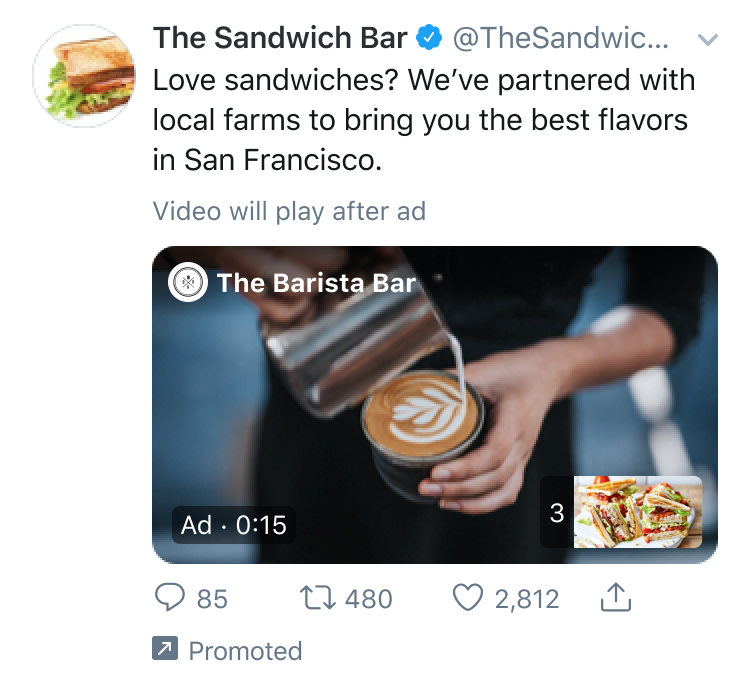 A promoted tweet from The Sandwich Bar featuring an in-stream video ad from The Barista Bar. The ad shows a person pouring milk to create latte art in a coffee cup. This image is an example of an in-stream video ad, a format used for Twitter ads.
