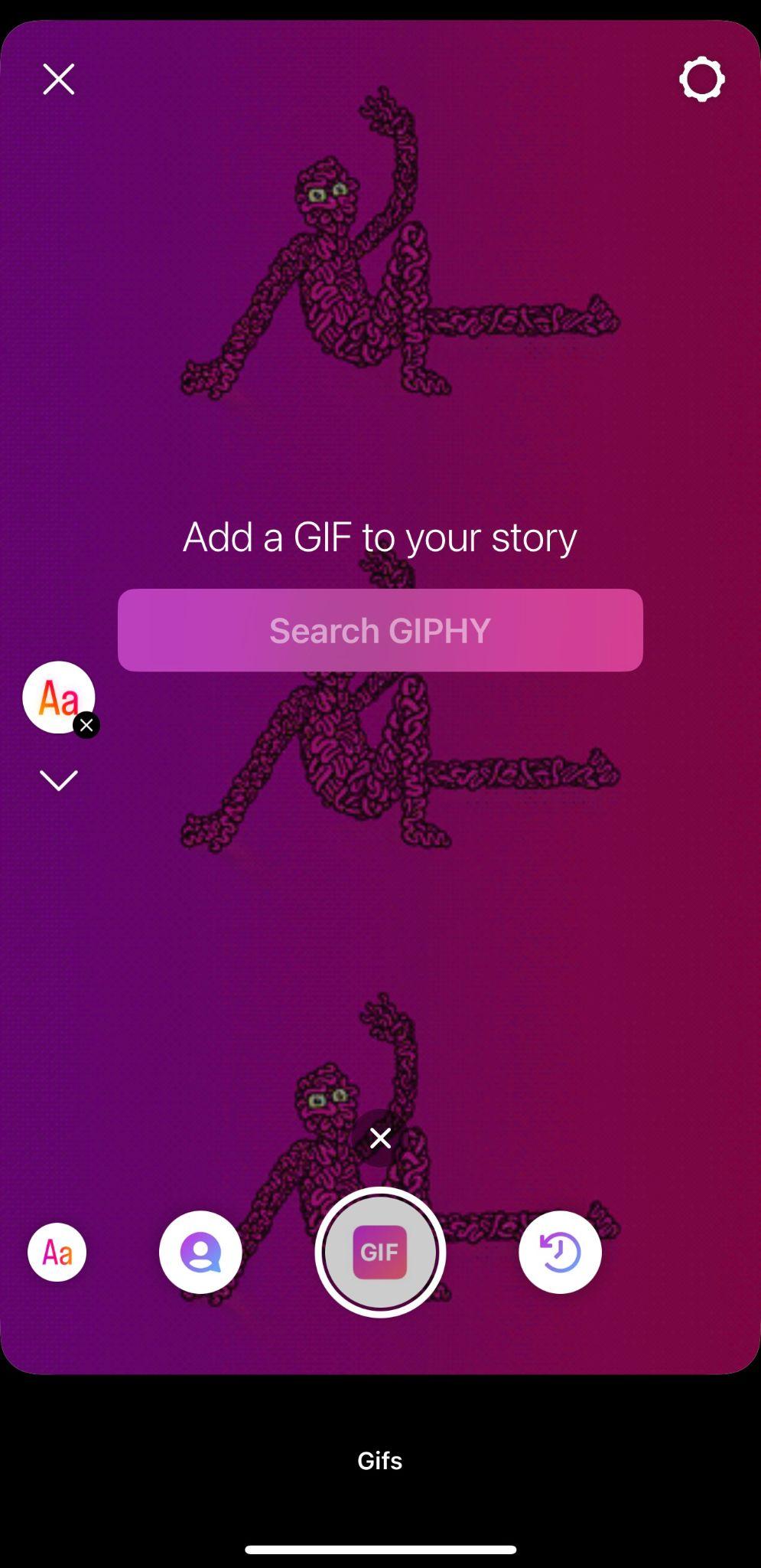 instagram story camera showing GIPHY search function and static GIF in the background of a pink monster smiling and waving