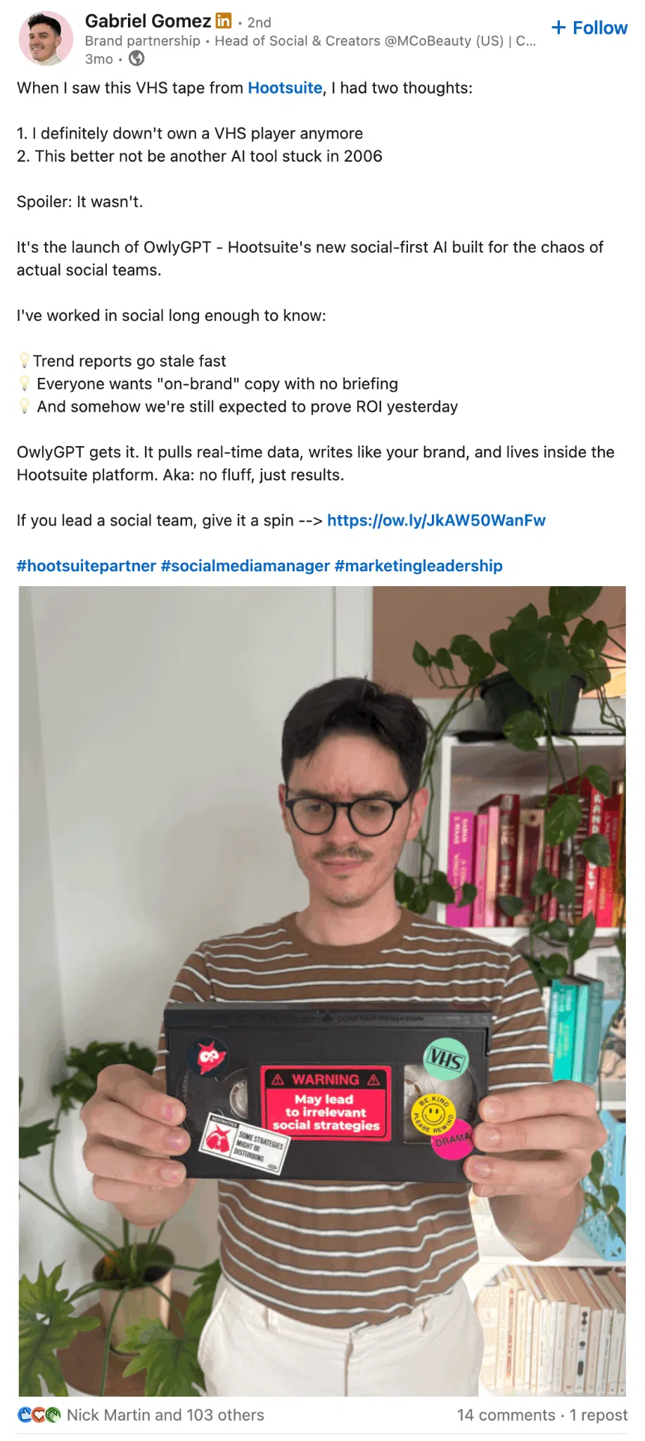 LinkedIn post by Gabriel Gomez holding a VHS tape labeled “May lead to irrelevant social strategies.” The caption introduces OwlyGPT, Hootsuite’s AI tool for social media teams. The post emphasizes real-time insights and brand-consistent copywriting.