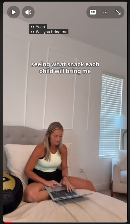 Screenshot of a YouTube video. A woman sits on a bed with a laptop. On-screen text reads: "seeing what snack each child will bring me."